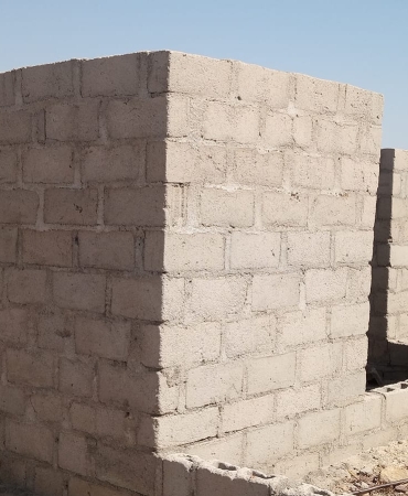 Two single rooms with public toilet and uncompleted two bedrooms flat.